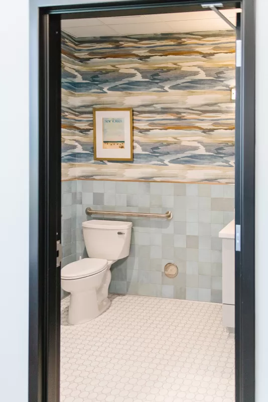 interior-impressions-horton-orthodontics-woodbury-mn-bathroom-white-floor-split-wall-blue-tile-design